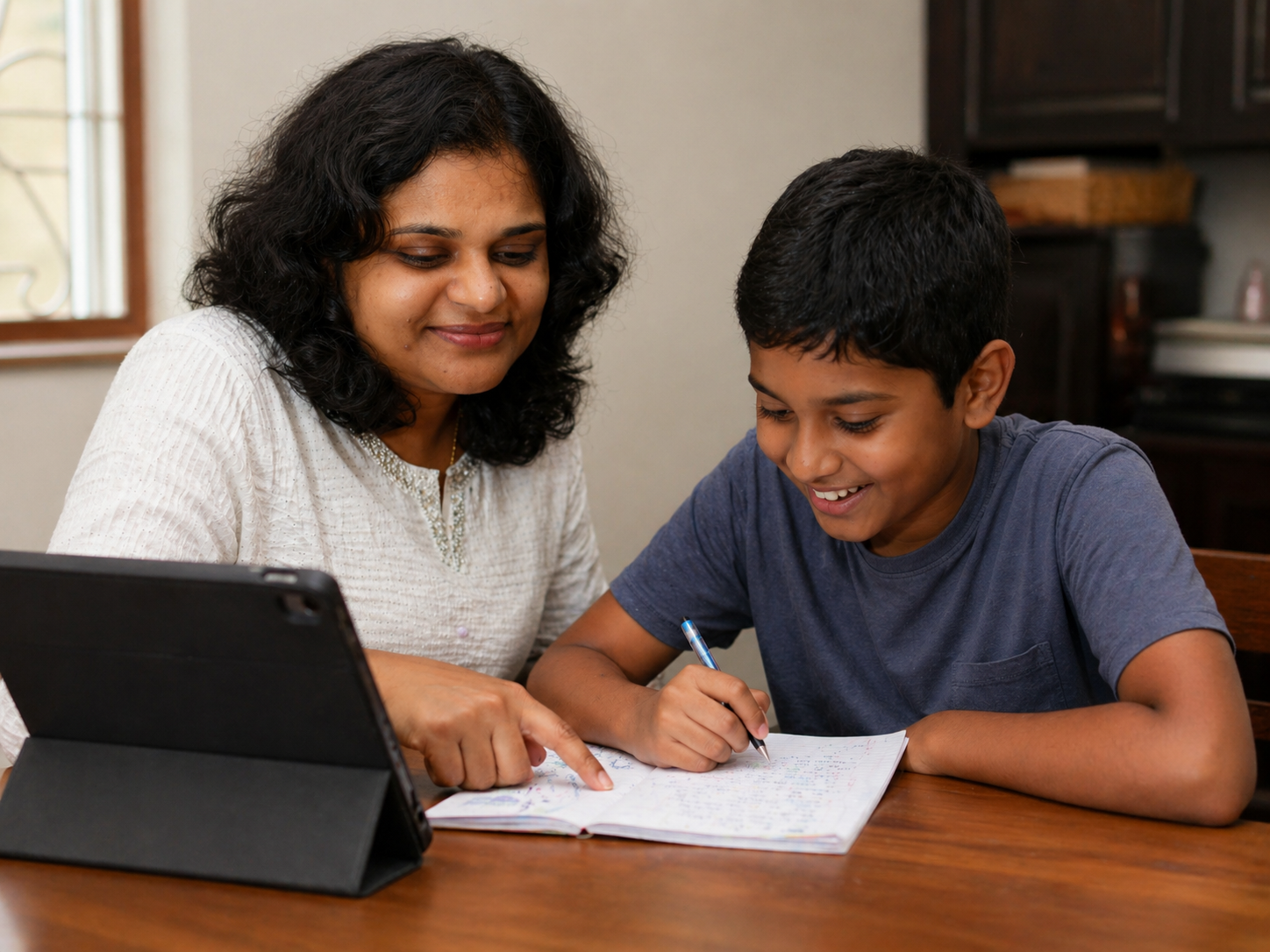 Alka in friendly conversation with a student during a tuition session